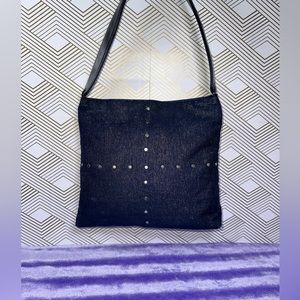 Beautiful shimmering dark blue handbag with cross design